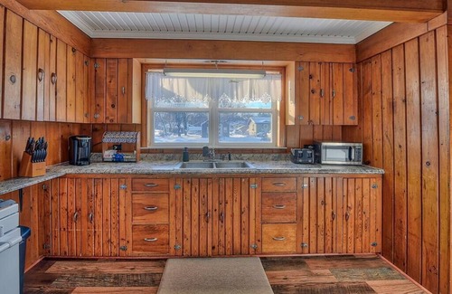Newberry House | Guest Rated: Griffin's Sleek Pine Hideaway with Kitchen
