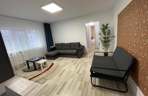 Buzau Apartment | Guest Rated 10/10: Grove Apartment with Hot Tub & Kids' Amenities