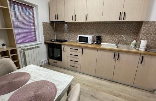 Buzau Apartment | Guest Rated 10/10: Grove Apartment with Hot Tub & Kids' Amenities