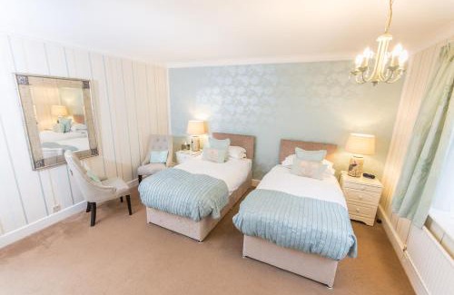 Canford Cliffs Hotel | Grovefield Manor: Oceanfront Retreat with 4-Star Comfort