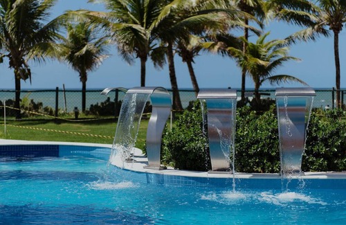 Abrantes Apartment | Discover Guarajuba Beach: Ocean View, Pool & Spa Retreat