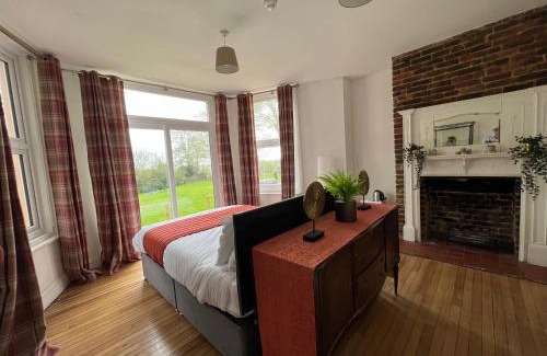Hastings Hotel | Discover Guestling House: Pet-Friendly Retreat with Fireplace