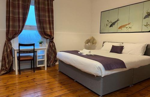 Hastings Hotel | Discover Guestling House: Pet-Friendly Retreat with Fireplace