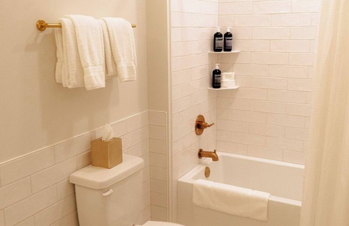 Elk Rapids Apartment | Elegant Guest Room with King Bed and Lake View
