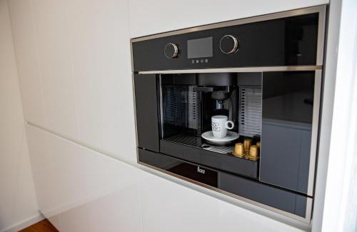 Guimaraes Apartment | Discover GuimaGold: 4-Star Stay with Family-Friendly Perks