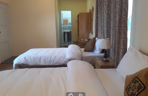 Gulmit Hotel | Explore Gulmit Tourist Inn: Family-Friendly Retreat Awaits