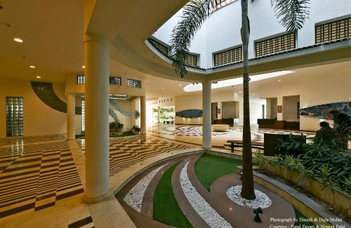 Sanand Resort | Relax at Gulmohar Greens Golf & Country Club with Pool Access