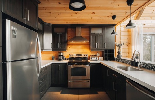 Saint-Joseph-de-la-Rive Ski Chalet | Relaxing Retreat at Chalet du Bois: Spa & Scenic Views