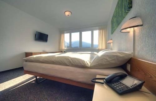 Moutier Hotel | Discover Hôtel Oasis: Rated 8.8 with Pool and Spa Access
