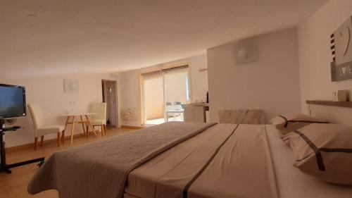 Pinar del Advocat Apartment | Cozy Room with Sloped Ceiling and Ocean View