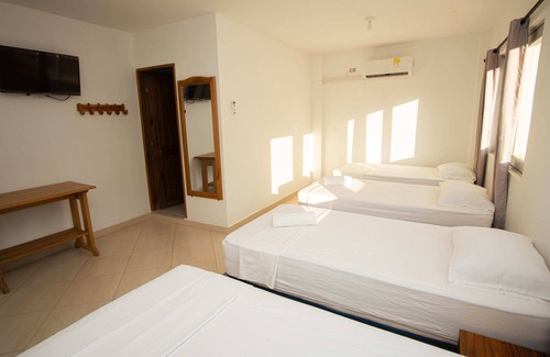 Covenas Hotel | Spacious Quadruple Room with Balcony Near the Beach in Coveñas