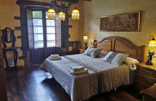 Navia de Suarna Apartment | Quadruple Room with Barbecue and Patio for Your Family Getaway