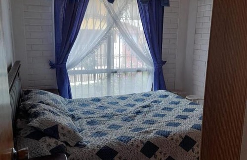 Constitucion House | Cozy Family Room with Ocean View & Pet-Friendly Amenities