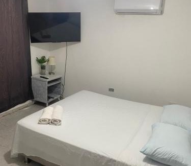 Crespo Apartment | Convenient Rooms Near the Airport with Family Amenities