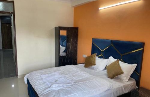 Sainik Farm Hotel | Budget-Friendly Stay at Happy Residency Unit 2 with Breakfast