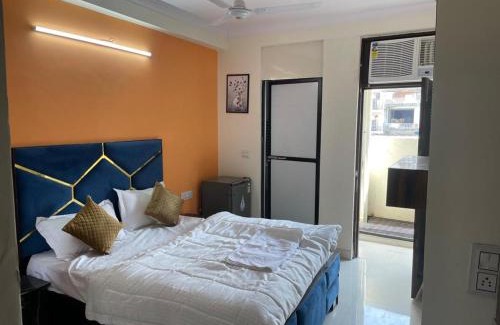 Sainik Farm Hotel | Budget-Friendly Stay at Happy Residency Unit 2 with Breakfast