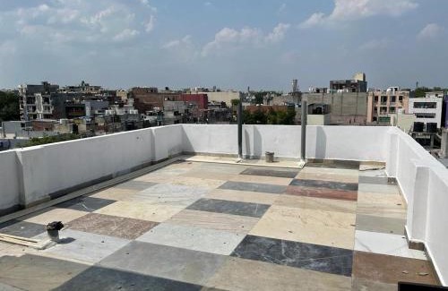 Sainik Farm Hotel | Budget-Friendly Stay at Happy Residency Unit 2 with Breakfast