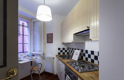 Castelletto Apartment | Central Happy Square: Family-Friendly with Breakfast Included