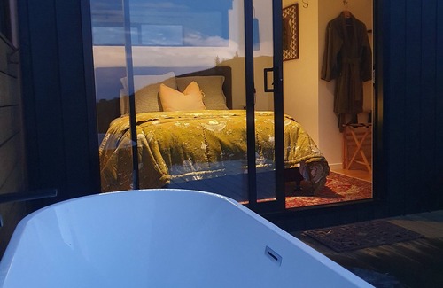 Hapuku Cabin | Eco Tiny House at Hapuku River with Ocean View & Pet Friendly