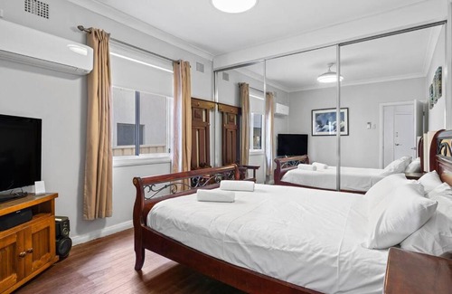 Stockton House | Harbour-Front Retreat in Stockton NSW with Family Amenities