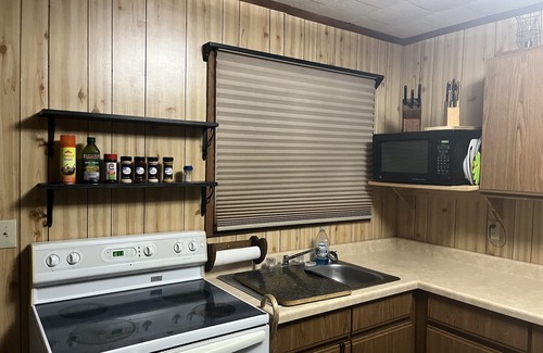Neillsville Cabin | Hatfield Cabin: Waterfront Retreat with Hot Tub & Kitchen