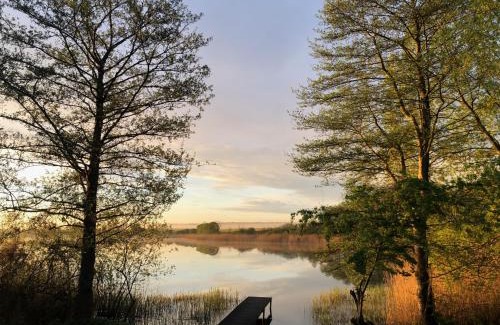 Wanzka House | Idyllic Lakeside Retreat with Boat, Sauna & Scenic Views