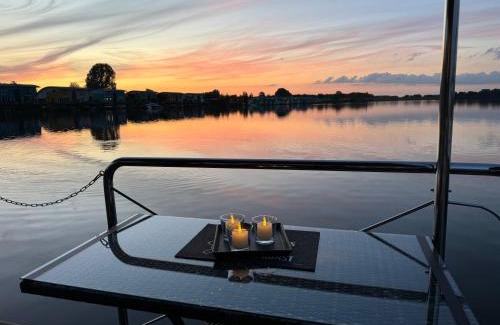 Lathum Boat Rental | Experience Nature Aboard Hausboot KOMET with Ocean Views