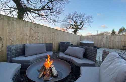 Tenby House | Discover Hazel Cottage: 4-Star Retreat with Hot Tub & Pets