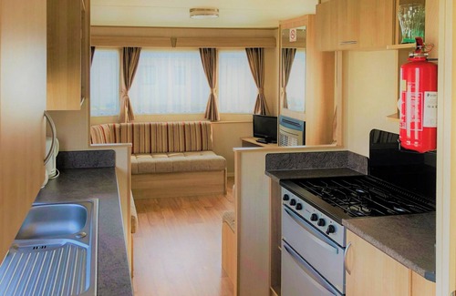Chapel Saint Leonards House | Cozy Caravan with Oceanfront Views & Pool Access