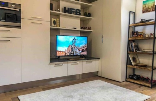 Historic Center Apartment | Prime Location: Steps from the Two Towers with Family Perks