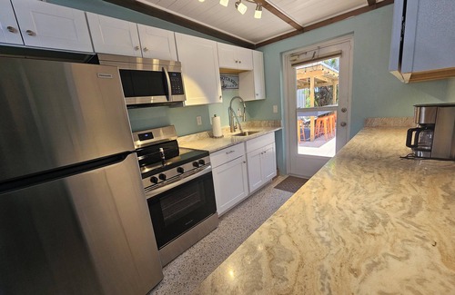 Englewood House | Experience Outdoor Fun with Heated Pool & Tiki Bar!