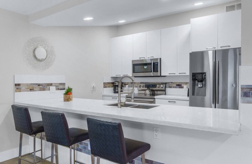 Coral Ridge Apartment | Relaxing Retreat with Heated Pool & Steps to the Beach
