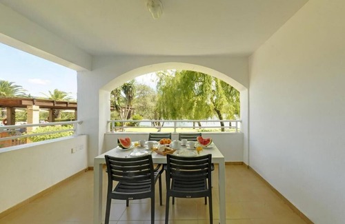 Gouvia Apartment | Beachside Retreat at Helion Resort: Oceanfront Duplex Escape