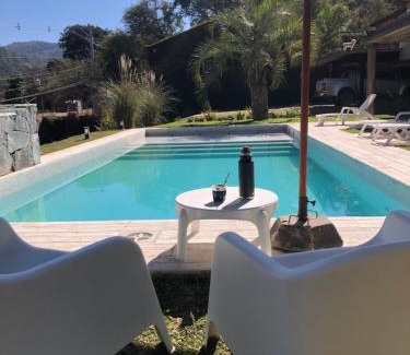 San Salvador de Jujuy House | Inviting Coastal Retreat with Pool and Fire Patio
