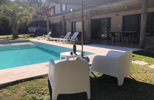 San Salvador de Jujuy House | Inviting Coastal Retreat with Pool and Fire Patio
