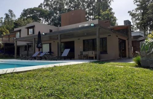 San Salvador de Jujuy House | Inviting Coastal Retreat with Pool and Fire Patio