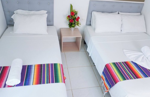 Covenas Hotel | Cozy Oceanfront Triple Room Steps from the Beach