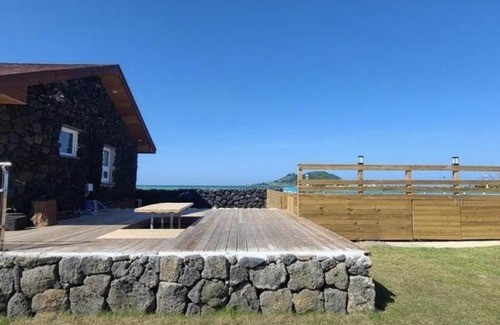 Hallim House | Relax at Hay Day Jeju: Oceanfront Retreat with Pool Access