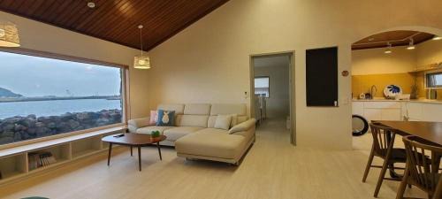 Hallim House | Relax at Hay Day Jeju: Oceanfront Retreat with Pool Access