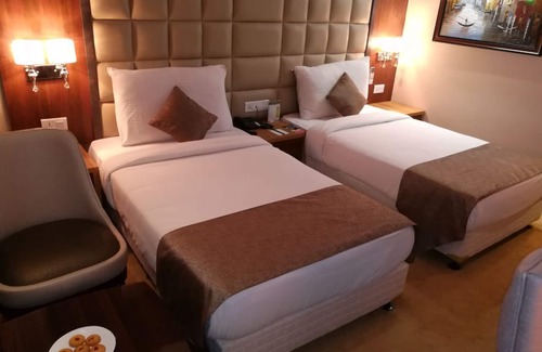 Noida Hotel | Relax at Hide Away Suites with Pool and Family Amenities