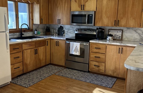 Higgins Lake House | Higgins Lake Getaway: Swim, Ride & Enjoy Lake Views!