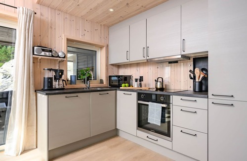 Hyllestad House | Hildebu by Interhome: Oceanfront Escape with Spa and Views