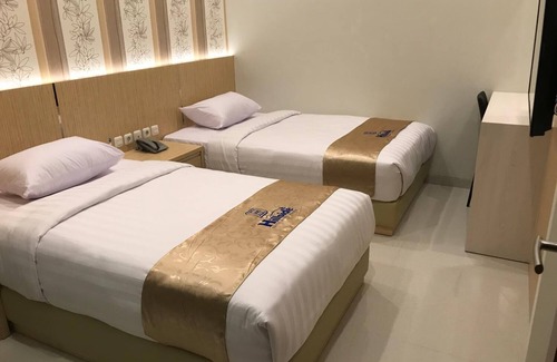 Dinoyo House | Cozy Hillside Suite Guest House with Family-Friendly Amenities