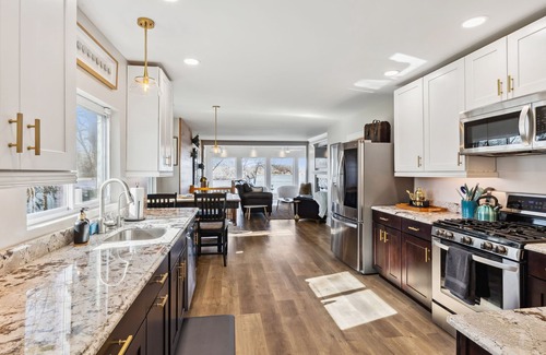 Portage Lakes House | Unforgettable Hilltop Lakehouse with Kayaks & Scenic Deck