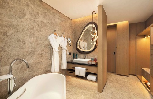 Nanxun Qu Hotel | Relax at Hilton Huzhou Nanxun: Pool, Spa & Dining Awaits