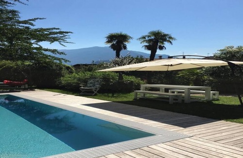 Riva del Garda Apartment | Historic Villa Near Beach with Pool and Spa Amenities