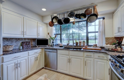 The Village Villa | Charming Historic Villa by Lake Hefner with Hot Tub & Pool Table