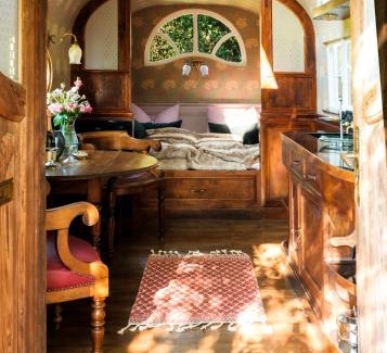 Fischach Other | Enchanting Vintage Circus Wagon Surrounded by Nature