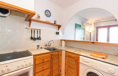 Arenal d'en Castell Apartment | Inviting Holiday Apartment in Arenal Castell with Pool & Garden