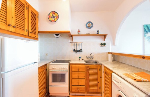 Arenal d'en Castell Apartment | Inviting Holiday Apartment in Arenal Castell with Pool & Garden
